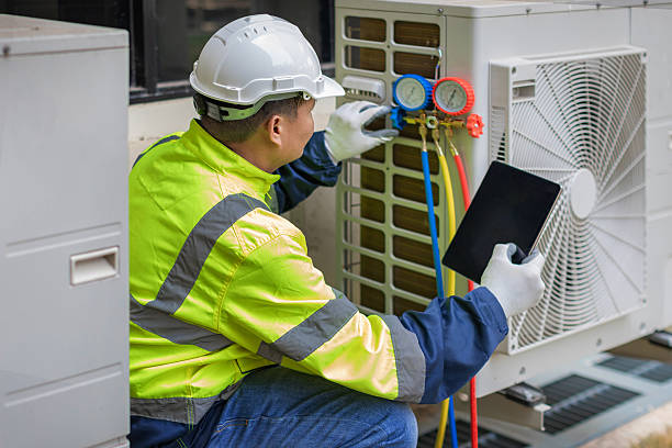 Professional Air Duct Cleaning technician working in Plainville, MA